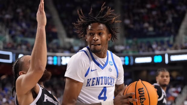 Mar 17, 2023; Greensboro, NC, USA; Kentucky Wildcats forward Daimion Collins (4) controls the ball against Providence Friars guard Jared Bynum (4) in the second half at Greensboro Coliseum. Mandatory Credit: Bob Donnan-USA TODAY Sports